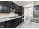 Well-equipped kitchen with gas cooktop and granite counters at 21004 E Sunset Dr, Queen Creek, AZ 85142