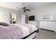 Main bedroom with dresser and ensuite access at 21004 E Sunset Dr, Queen Creek, AZ 85142