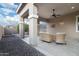 Covered patio with wicker furniture and view of backyard at 21004 E Sunset Dr, Queen Creek, AZ 85142