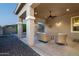 Covered patio with wicker seating and a view of the backyard at 21004 E Sunset Dr, Queen Creek, AZ 85142