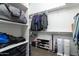 Large walk-in closet with shelving and hanging rods at 21004 E Sunset Dr, Queen Creek, AZ 85142