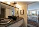 Bathroom with black vessel sink, and view of bedroom at 2323 N Central Ave # 504, Phoenix, AZ 85004