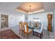 Elegant dining room with glass table and light blue chairs at 2323 N Central Ave # 504, Phoenix, AZ 85004