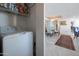 Stackable washer and dryer in laundry closet with additional storage at 2323 N Central Ave # 504, Phoenix, AZ 85004