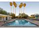 Refreshing pool with palm trees and plenty of lounge space at 2323 N Central Ave # 504, Phoenix, AZ 85004