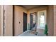 Front entry with security door, modern doormat, and potted plants at 23776 N 167Th Ln, Surprise, AZ 85387