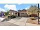 Two-car garage with neutral-color exterior and landscaping at 23776 N 167Th Ln, Surprise, AZ 85387