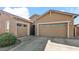 Two-car garage with neutral-color exterior and landscaping at 23776 N 167Th Ln, Surprise, AZ 85387