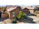 One story home with a two-car garage and rock accents at 23776 N 167Th Ln, Surprise, AZ 85387