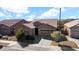 Single-story home with a two-car garage and desert landscaping at 23776 N 167Th Ln, Surprise, AZ 85387