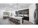 Modern kitchen with dark cabinetry, island, and stainless steel appliances at 23776 N 167Th Ln, Surprise, AZ 85387