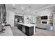 Open concept kitchen features an island and breakfast bar, looking into the living room at 23776 N 167Th Ln, Surprise, AZ 85387