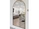 Large arched mirror reflecting the living and kitchen areas at 23776 N 167Th Ln, Surprise, AZ 85387