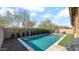 Inviting backyard oasis featuring a sparkling pool and lush landscaping at 23776 N 167Th Ln, Surprise, AZ 85387