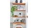 Stylish built-in shelving unit with decorative items at 23776 N 167Th Ln, Surprise, AZ 85387