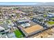 Expansive aerial view of a modern home, showcasing the outdoor oasis with pool, green spaces, and mountain views at 24540 S 190Th Ct, Queen Creek, AZ 85142