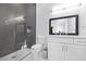 Bathroom showcasing a walk-in shower with gray tile, white vanity, and white hexagon tile floor at 24540 S 190Th Ct, Queen Creek, AZ 85142