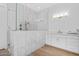 Bathroom with a white marble tiled walk-in shower, frameless glass, and white cabinets at 24540 S 190Th Ct, Queen Creek, AZ 85142