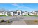 Beautifully landscaped home with a tile roof and long stone driveway leading to an arched front entry at 24540 S 190Th Ct, Queen Creek, AZ 85142