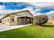 Backyard view of home with covered patio at 25740 W Watkins St, Buckeye, AZ 85326