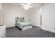 Bedroom with ceiling fan and gray carpet at 25740 W Watkins St, Buckeye, AZ 85326