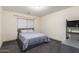 Cozy bedroom with a double bed and built-in shelving at 25740 W Watkins St, Buckeye, AZ 85326