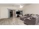 Spacious living room with L-shaped sectional sofa at 25740 W Watkins St, Buckeye, AZ 85326