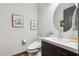 Modern bathroom with updated vanity and toilet at 26019 W Ponderosa Ln, Buckeye, AZ 85396