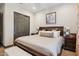 Bright bedroom featuring a king-size bed and large closet at 26019 W Ponderosa Ln, Buckeye, AZ 85396