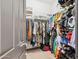 Well-organized walk-in closet with shelving and hanging rods at 26019 W Ponderosa Ln, Buckeye, AZ 85396