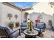 Relaxing courtyard with seating area and potted plants at 26019 W Ponderosa Ln, Buckeye, AZ 85396