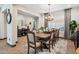 Elegant dining room with a large table and chandelier at 26019 W Ponderosa Ln, Buckeye, AZ 85396