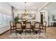 Elegant dining room featuring a large table and chandelier at 26019 W Ponderosa Ln, Buckeye, AZ 85396