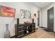 Inviting entryway with console table, mirror, and wood floors at 26019 W Ponderosa Ln, Buckeye, AZ 85396