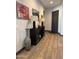 Bright entryway with dark wood console table and tall vase at 26019 W Ponderosa Ln, Buckeye, AZ 85396