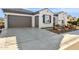 Two-car garage and a well-manicured front yard at 26019 W Ponderosa Ln, Buckeye, AZ 85396