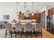 Modern kitchen with granite countertops and wood cabinets at 26019 W Ponderosa Ln, Buckeye, AZ 85396