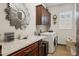 Laundry room with washer, dryer, and built-in cabinets at 26019 W Ponderosa Ln, Buckeye, AZ 85396