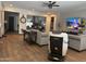 Spacious living area with hardwood floors and large TV at 26019 W Ponderosa Ln, Buckeye, AZ 85396