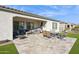 Outdoor patio with seating area and artificial turf at 26019 W Ponderosa Ln, Buckeye, AZ 85396