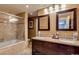 Bathroom with double vanity, granite countertop, and a shower/tub combo at 2645 E Glenrosa Ave, Phoenix, AZ 85016