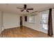 Bright bedroom featuring wood flooring and sliding door access at 2645 E Glenrosa Ave, Phoenix, AZ 85016