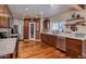 Spacious kitchen featuring wood cabinets, stainless steel appliances, and hardwood floors at 2645 E Glenrosa Ave, Phoenix, AZ 85016