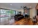 Living area featuring hardwood floors, fireplace, and sliding glass doors to backyard at 2645 E Glenrosa Ave, Phoenix, AZ 85016