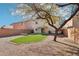 Spacious backyard with artificial turf, patio, and hammock at 28125 N Silver Ln, San Tan Valley, AZ 85143