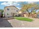 Spacious backyard with artificial turf, patio, and hammock at 28125 N Silver Ln, San Tan Valley, AZ 85143