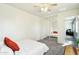 Well-lit bedroom featuring mirrored closet and orange pillows at 28125 N Silver Ln, San Tan Valley, AZ 85143