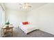 Spacious bedroom with ceiling fan and wood table at 28125 N Silver Ln, San Tan Valley, AZ 85143