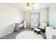 Bedroom with a crib, rocker, and dresser, featuring soft, neutral colors at 28125 N Silver Ln, San Tan Valley, AZ 85143