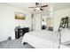 Bright bedroom with mirrored closet and ceiling fan at 28125 N Silver Ln, San Tan Valley, AZ 85143